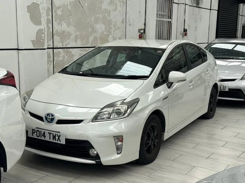 White Toyota Prius from HDG Cars stock, illustrating Japanese-import ownership checks
